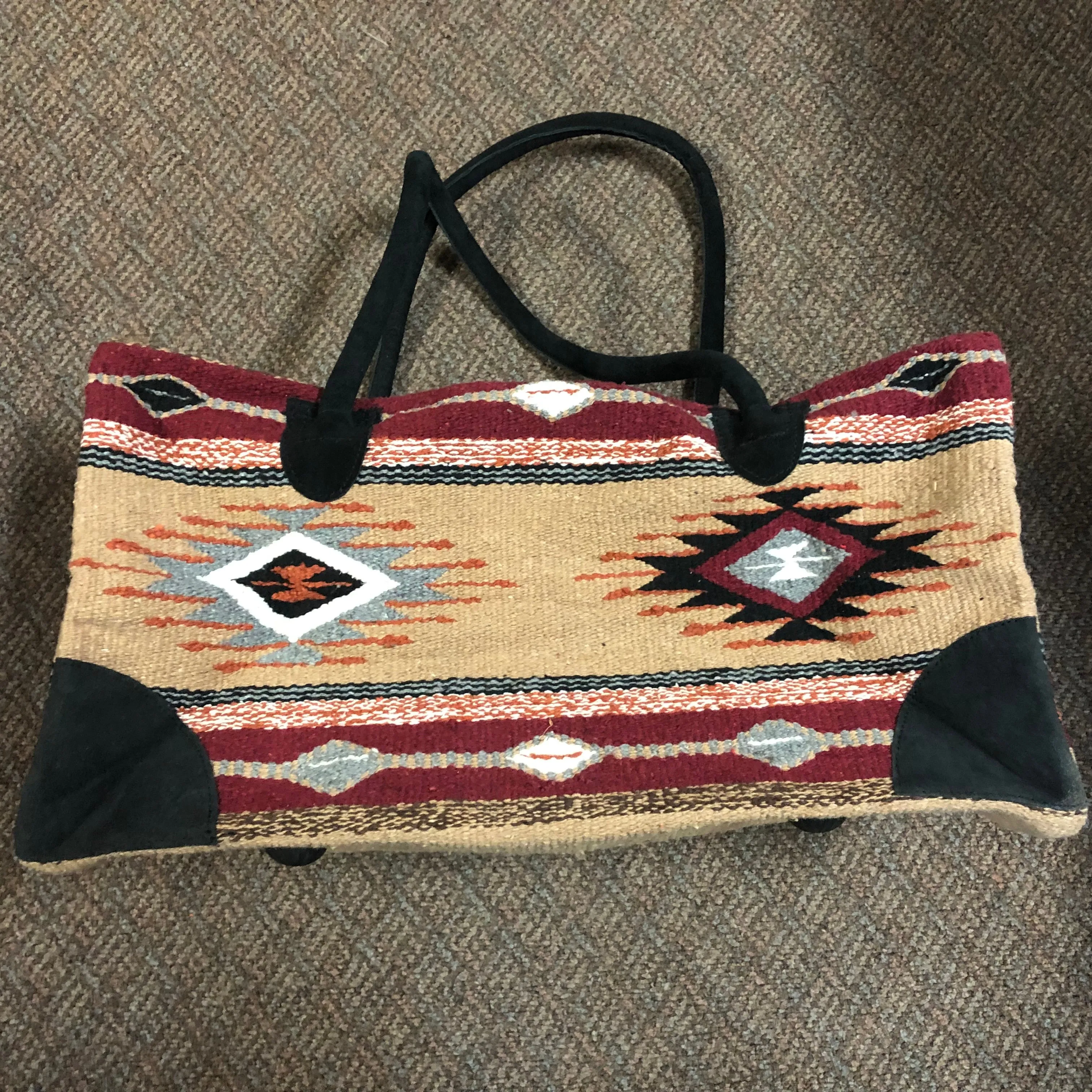 Handwoven recycled acrylic Southwest style weekender bag.  22” x 10” x 12” high.